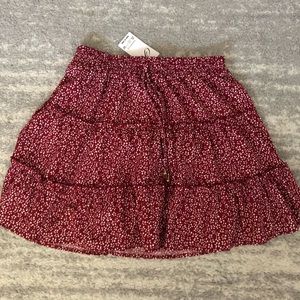 red floral skirt